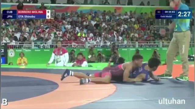 Coach Cary Kolat and Chael Sonnen explaining the Cuban wrestling style.