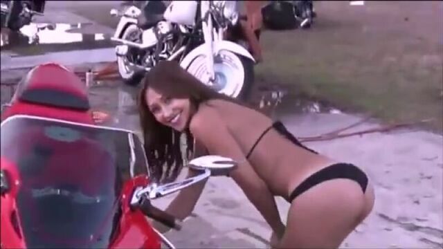 Moto wash skinny beautiful young girl in a bikini