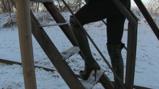 Sexy Girl Walk in High Heels Boots on Snow