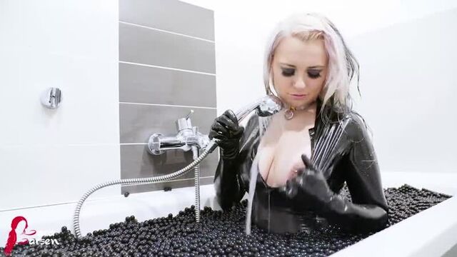 Latex Slut shows pierced nipples