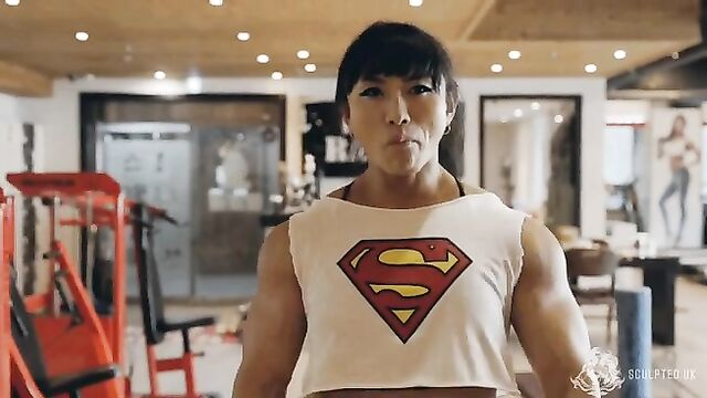Fit Asian MILF shows off her muscles and big ass in action