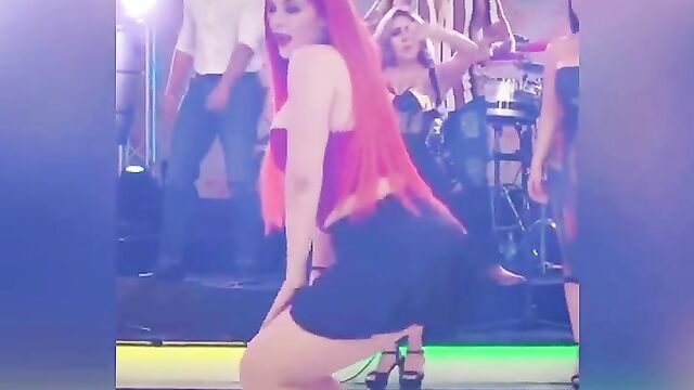A random girl with big boobs is doing strange things with her curvy body