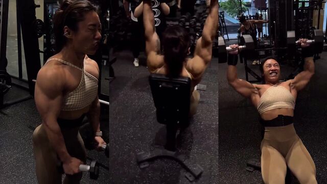 Chinese female bodybuilder does squats with her trainer in the gym