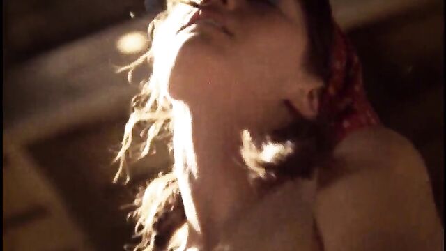A lesbian sex scene with a nude actress performing passionately