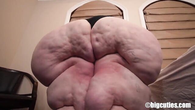 Busty SSBBW shows off her huge boobs and fat rolls while getting intimate
