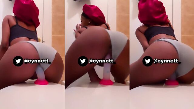 Petite ebony teen rides a huge black dildo with intense passion
