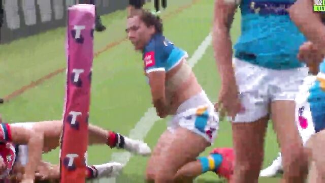Rugby Coach Tying Up His Player for a Hard Public Session