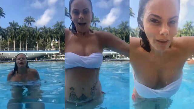 Hot TV host wearing lingerie and dental floss, enjoying herself on the beach