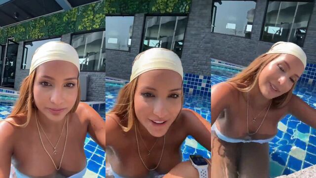 A hot Latina with big boobs takes a steamy bath in the pool