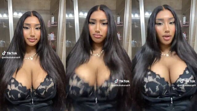A goth girl with mommy milkers films herself while her boyfriend works in the next room