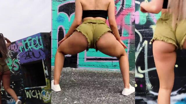 A hot girl is dancing sexy twerk on the bed with her ass