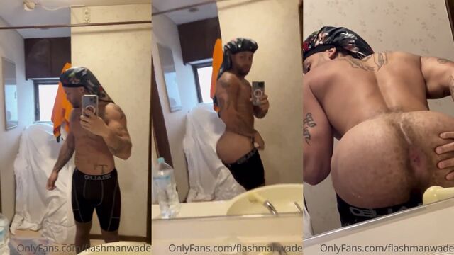 Muscular IG model FlashmanWade shows off his big black cock