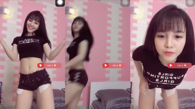 Hot Asian girl dances and spreads her sexy legs