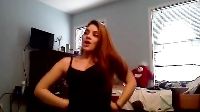 A cute girl is dancing sexy twerk in the shower and sudsy water