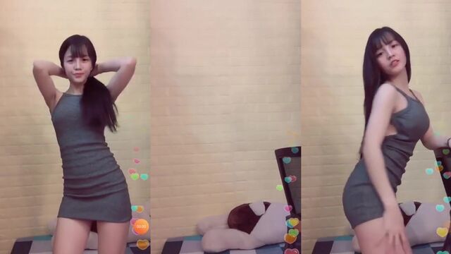 The sexy girl is dancing and shaking her ass with passion