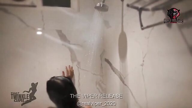 A stunning Indian beauty enjoys a hot shower and some fingering action