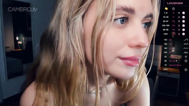 A girl plays with her pierced nipples and gets excited