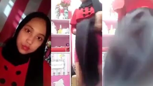 A Muslim woman, covered from head to toe in black, experiences intense pleasure in the bathroom