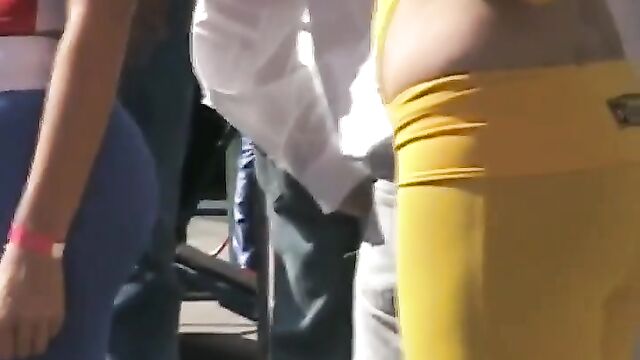 A beautiful woman has no bra and a see-through shirt in public