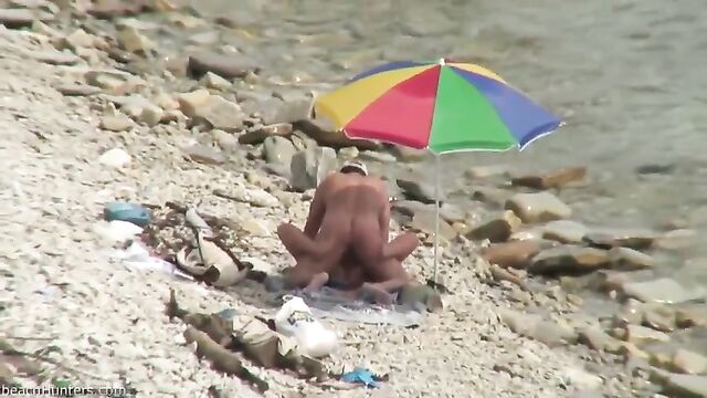 Strangers watching us as we share wife in public beach scene