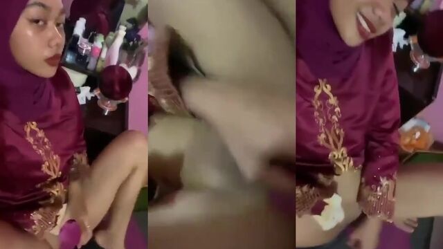 Hijab-wearing Asian slut uses a dildo to get fucked hard