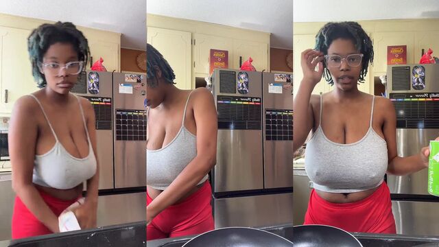 A girl with big tits poses for social media in the bedroom
