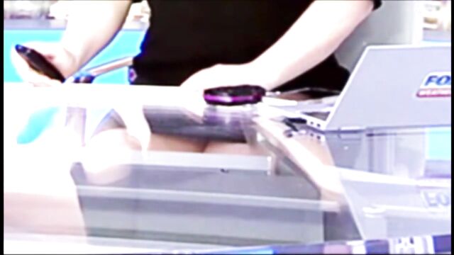 A weathergirl gets upskirt shots while doing the weather forecast