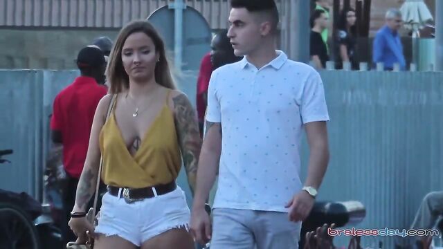 Hot MILF flashing big natural boobs in public place