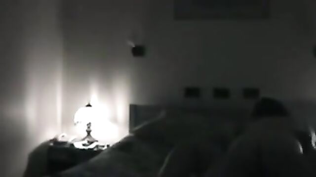A man films his wife with her lover in an intimate act