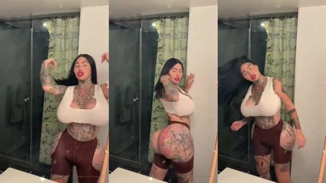Bimbo Mary Magdalena shows off her huge fake tits and round ass