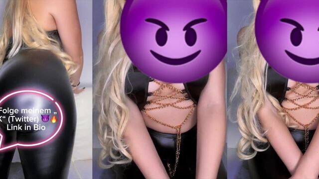 The mistress wears leather leggings while punishing her slave