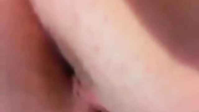 Brunette amateur masturbates her shaved pussy with a strong vibrator