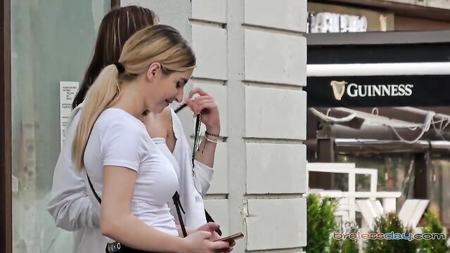 Beautiful girls are having fun in public without bras and see-through shirts
