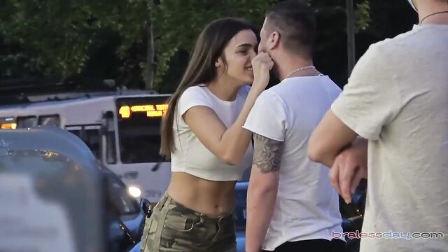 Beautiful girls are having fun in the public park without bras