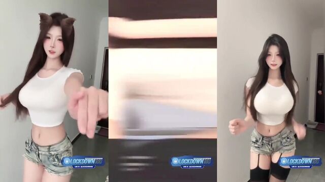 A cute young Chinese girl is dancing sexy on her room