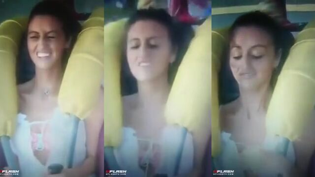 A girl has a sling shot and she uses it to get cum on her face
