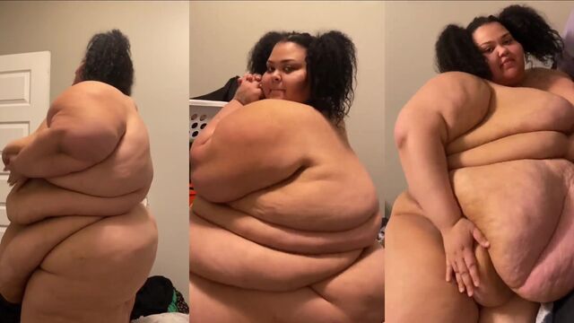 A chubby girl shakes her big belly in a tight dress