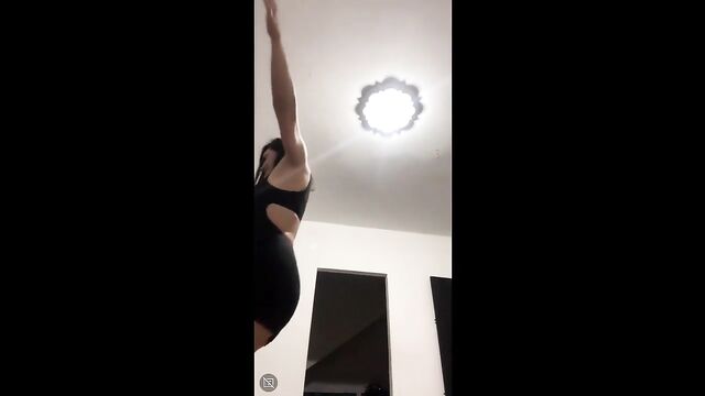 Barefoot Latina in sexy red lingerie flashes below the waist