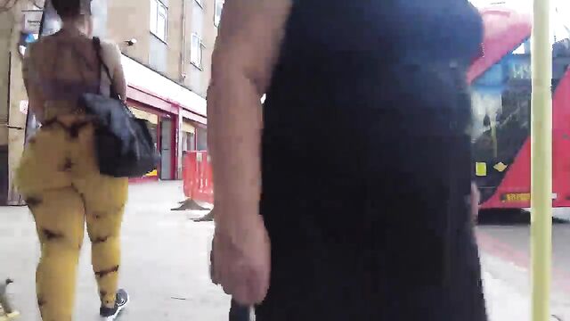 Candid ass shot of a girl in a short skirt walking on the street
