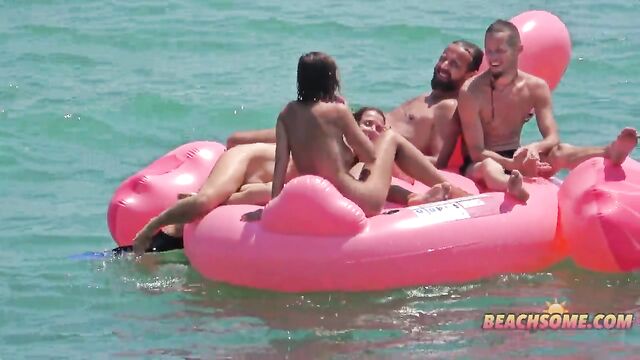 Topless beauty with big tits has sex on the public beach in HD