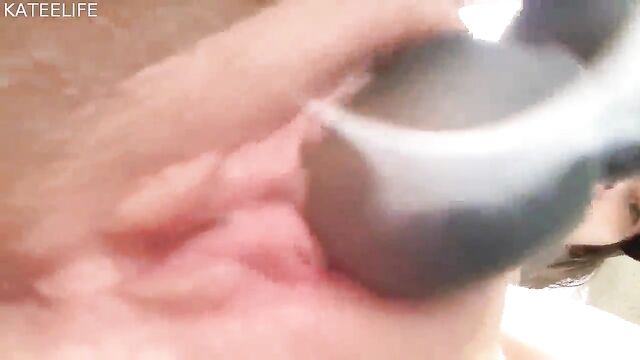 Busty MILF washes in the shower and fingering her wet pussy and pissing closeup