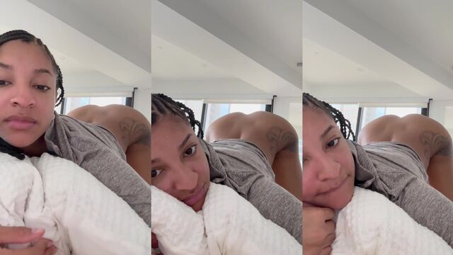 Light skinned ebony beauty twerks on the bed with braids and pillow