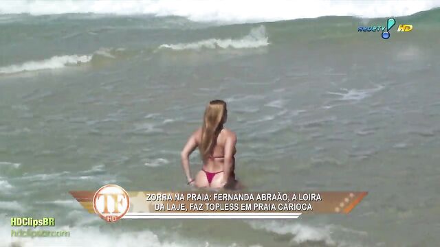 Bikini-clad women enjoy funkeira party on the beach