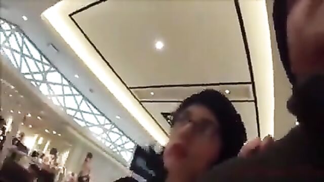 Brunette woman caught having sex in the mall, she gets a facial