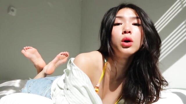 Asian girl plays with her feet, a true goddess in humiliation