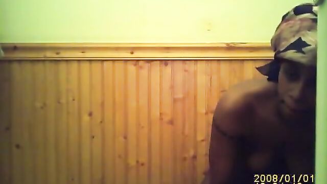 Ebony girl has sex with her vibrator in the bathroom
