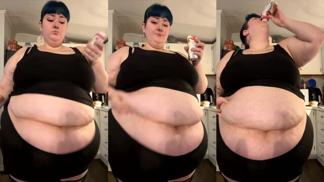 A fat woman with a huge belly gets fed by her partner