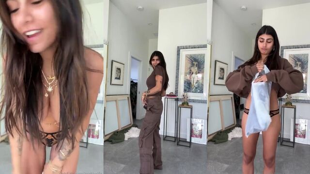 Blue paste on Mia Khalifa’s tits, she strips and shows her body in the kitchen