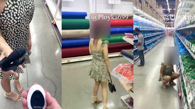 An old man is having fun with a young Thai girl in a public place