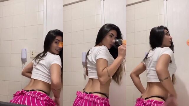 A hot young woman wiggling her ass to some funk music